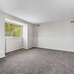 carpeted living room entrance at the Oakley apartment homes in Tuscaloosa, AL